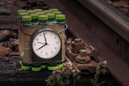 Dangerous timed bomb placed on railsの写真素材