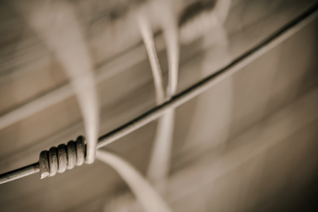Detail of fence as a symbol of connection on blurred abstract backgroundの写真素材