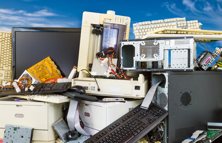 Electronic, plastic and metal waste on a dump of discarded computer components. Pile of obsolete...