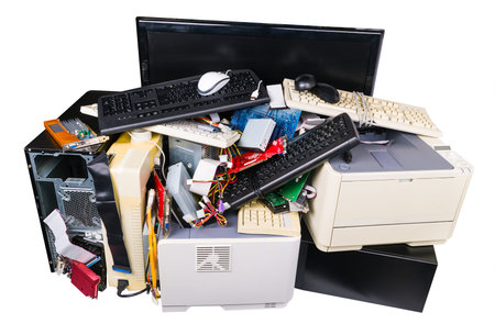 Pile of discarded computer parts isolated on white background. Used hardware components as...