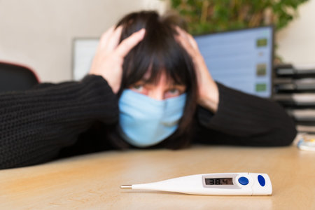 Covid-19 outbreak. Electronic medical thermometer with measured high temperature. Fear of pandemic...