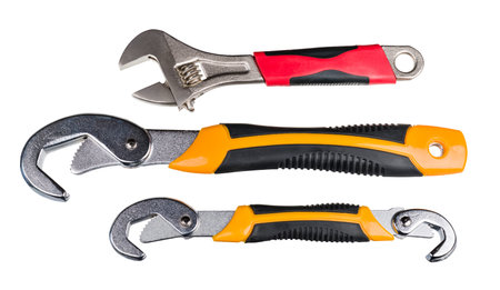 Set of metal hand tools for screwing and tightening nut or bolt isolated on a white background....