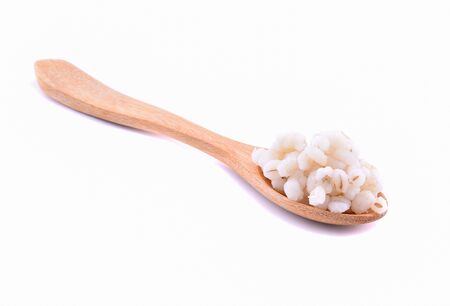JOB'S TEARS with spoon isolated on white backgroundの写真素材