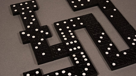 Domino game  on a grey background