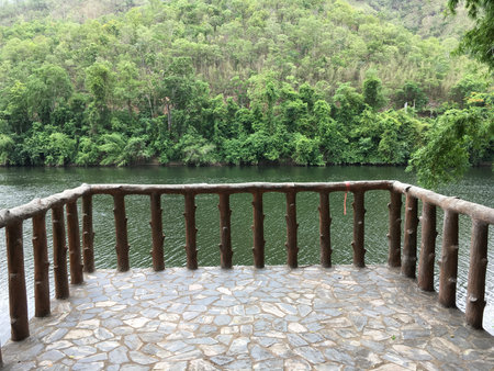 Balcony to nature, take a deep breath to refresh in green environmentの写真素材
