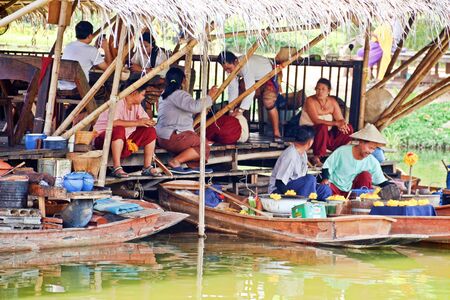 Kanchanaburi, Thailand: January 20, 2019: Life nearby the river. Simulating the ancient Thai lifestyle at Mallika city, 1905 A.D. in Kanchanaburi, Thailandのeditorial素材