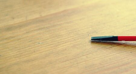 Flat head VDE screwdriver put on woodの写真素材