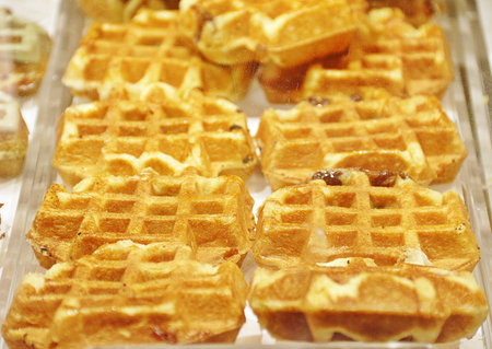 golden fresh baked waffles in tray