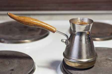 Family tradition of brewing coffee in cezveの写真素材