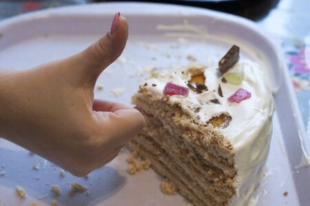 evaluating a piece of cakeの写真素材