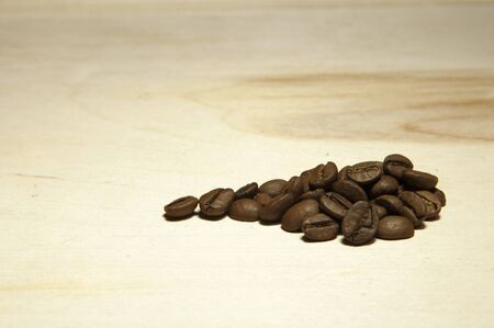 coffee beans on a wooden backgroundの写真素材