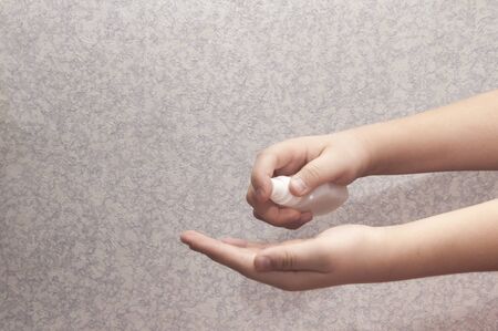 child's hand. antiseptic treatment. Coronavirusの写真素材