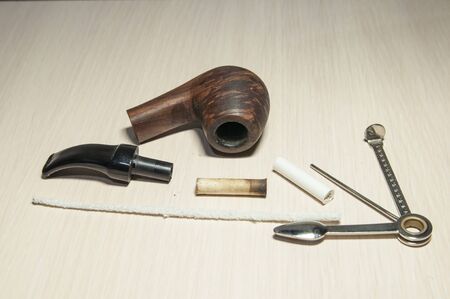 cleaning the Smoking pipe after useの写真素材