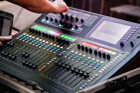 Sound engineer works with sound mixerの写真素材