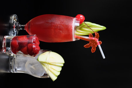 Strawberry mojito cocktail with ice on a black backgroundの写真素材