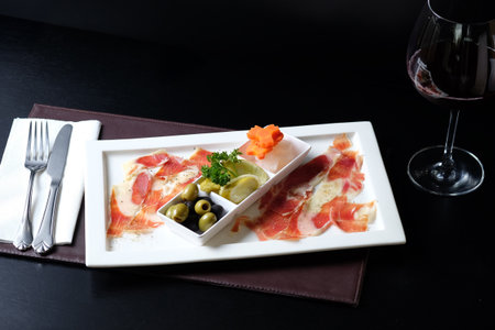 Appetizer with prosciutto, olives and cheeseの写真素材