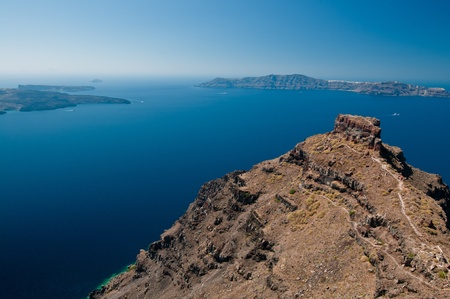 Agean sea view from Santorini island with hill and walking track in the foregroundの写真素材