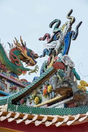 Roof top of Chinese temple with dragon carvingの写真素材