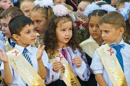 Odessa, Ukraine - September 1, 2015: elementary school students stand on the first day of the school year. Feast Day of Knowledge. Beginning of a new academic year.のeditorial素材