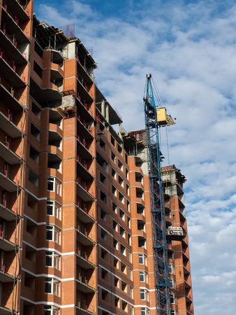 Building construction site work against blue skyの写真素材