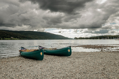 Two rowing boats with the overcast day at Coniston in Lake District, Englandの写真素材