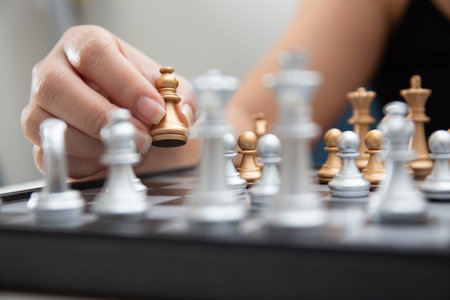 Close up shot of female hand playing chess