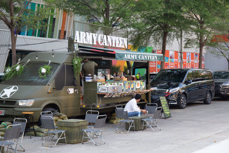 Ho Chi Minh city Vietnam March 14 2021. Food truck complex area with colorful truck selling food and...