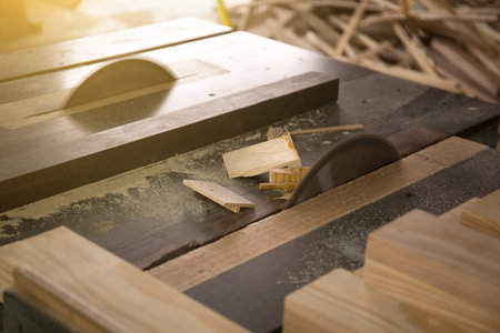 Close up shot of wood pieces on a saw machine