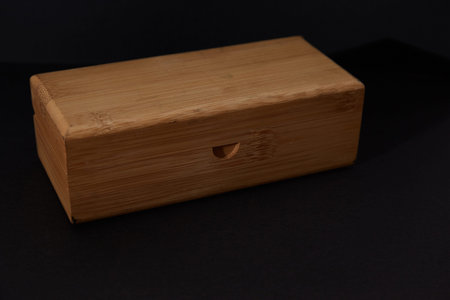 Wooden box on a black background. Place for your text.