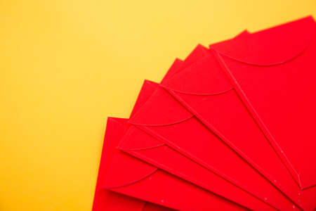 Red envelopes on yellow background. Copy space.の写真素材