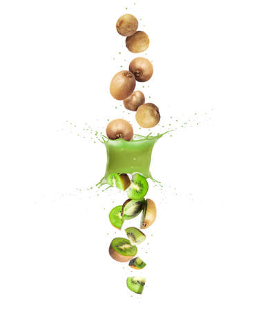 Whole and sliced fresh kiwi falling through a splash of juiceの写真素材