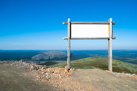 Blank billboard in the mountains