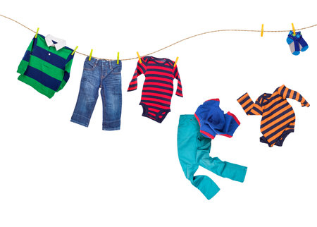 Laundry line with falling clothes on a white backgroundの写真素材