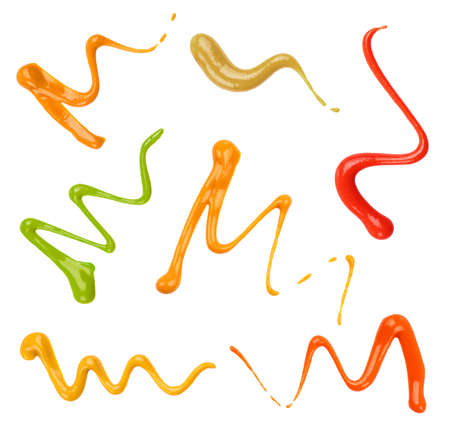 Close up of ketchup and sauce decor set on white backgroundの写真素材