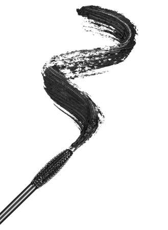 Stroke of black mascara with applicator brush close-up, isolated on white backgroundの写真素材