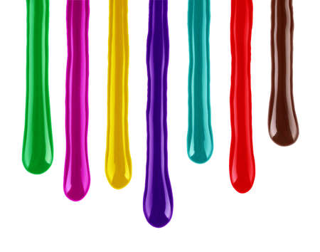 drips of colorful paint closeup isolated on white backgroundの写真素材