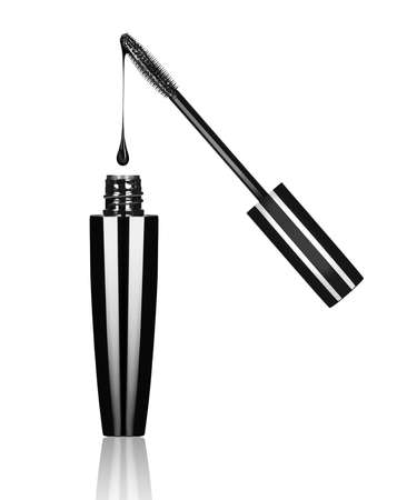 Close-up of black mascara brush with drop on white backgroundの写真素材