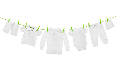 Laundry line with light clothes, isolated on white backgroundの写真素材