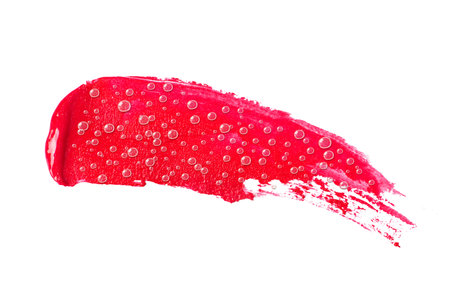 Cosmetic smear with drops close-up, isolated on white backgroundの写真素材