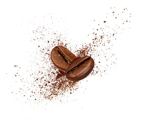 Two coffee beans collide in the air on white backgroundの写真素材