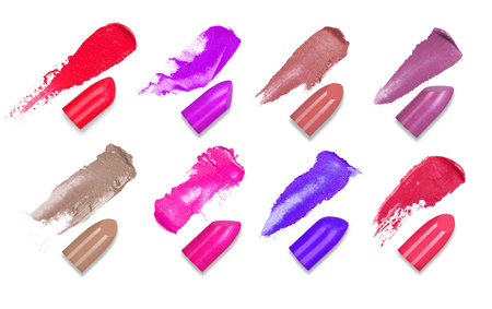 Set of colorful lipsticks smears with a slices of lipsticks isolated on a white backgroundの写真素材