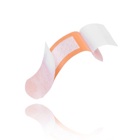 Open medical adhesive plaster close-up on white backgroundの写真素材