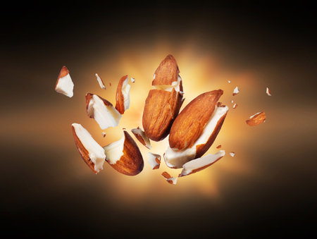 Almonds is torn to pieces close-up in the darkの写真素材