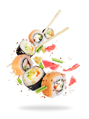 Different fresh sushi rolls with chopsticks frozen in the air on white backgroundの写真素材