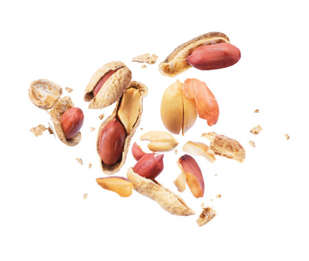Dried peanut crushed in the air isolated on white backgroundの写真素材