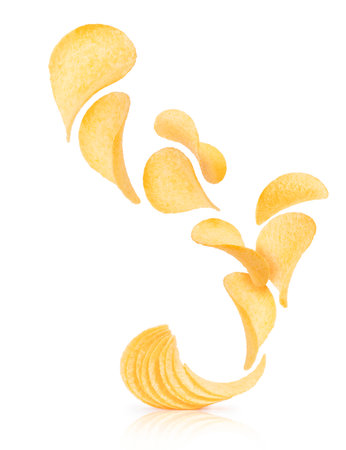 Potato chips rise up from the pile with chips on a white backgroundの写真素材