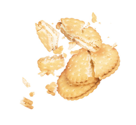 Tasty biscuit crushed into pieces close-up isolated on a white backgroundの写真素材
