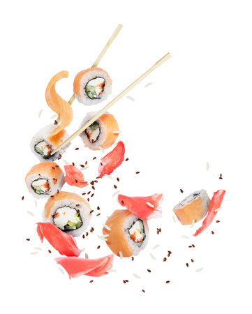 Pieces of fresh sushi with ginger frozen in the air, isolated on white backgroundの写真素材