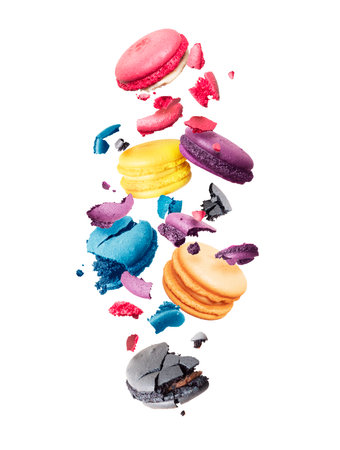 Ð¡olored macaroons is torn to pieces in the air on a white backgroundの写真素材