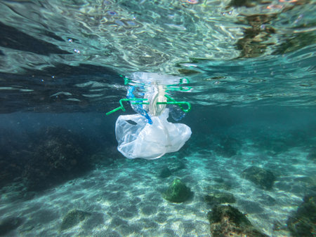 Plastic bags and bottles pollution in seaの写真素材